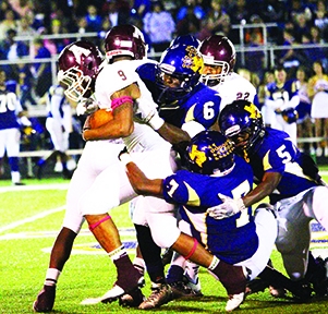 Atlanta’s Dequan Allen punishes Center’s defense as he carries three Roughriders with him on his way downfield. Allen scored one of the Rabbs’ eight touchdowns.