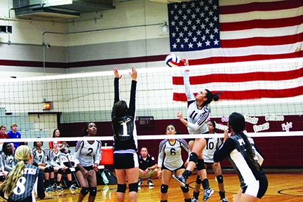 Atlanta senior Keandra Thomas blasts the ball past Pittsburg defenders.