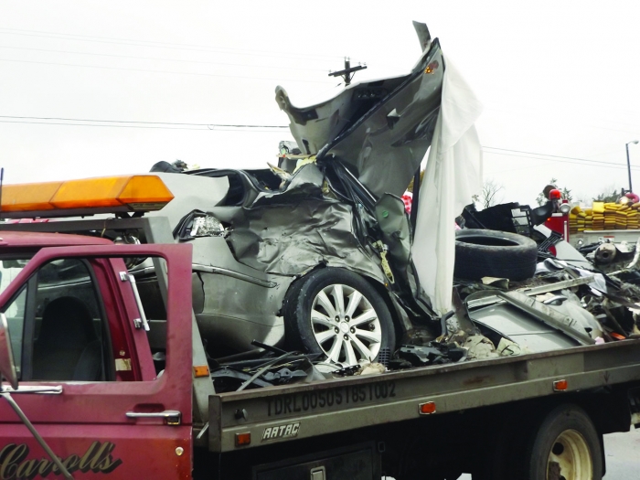 Photo by BOBBY HORN JR.  Two people were killed on U.S. Hwy 59 between Linden and Atlanta Nov. 29 when their vehicle hydroplaned across the highway, into the path of a tractor-trailer.