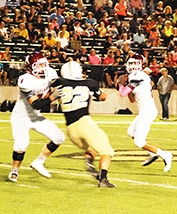 Atlanta quarterback Chase Musgrove gets a little more time to throw the ball downfield with a good block from Wesley Little.