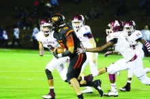 A Gilmer ball carrier is trapped by a troop of Rabbits as #3 Jeremy Smith, #8 Layton Henson, #5 Tyrell Phillips and #24 Funzell Coleman unite to bring him down.