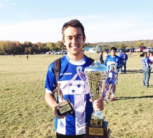 Carlos Ibarra holds on to his soccer hardware he received after competing in a match in Arkansas.