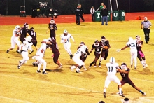 D’Corey Larry carries the ball for the Rabbits against the Tatum Eagles with significant blocks from Cade Coulter, Jeremy Smith, Dequan Allen, Clayton Hancock and Cole Davis.