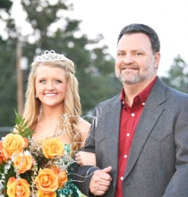 Queen City senior Hannah Hughey was crowned Football Sweetheart last Friday night during Homecoming festivities. Hughey is escorted by her father Dusty Wiley.