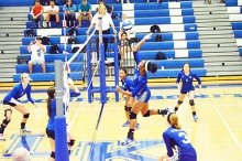 Linden-Kildare’s Shenari Green records a kill after smashing the ball over the net against Redwater.