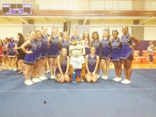 Linden-Kildare High School varsity cheerleaders pose with their trophy and NCA staff buddy at the cheer competition.  Kneeling from (L to R) is Haylee Smoak, Tory the Tiger and Jordann Schuler. Standing from (L to R) is Karlee Bynum, Amberley Cummings, Montana Caldwell, Christina Roberts, Haley Palmer, Lexi Loizeaux, Siarra Johnson, Reagan Lee, Surtraylon Grant and Shenari Green. Tory Willis was named an All-American Mascot at the competition.