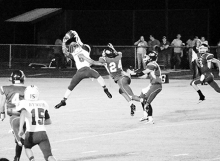 Linden-Kildare’s Marcus Jones leaps high into the air and snags a pass from quarterback Curt Wells against Harleton. Jones had a fumble recovery for a touchdown, a rushing touchdown and a 65-yard punt return in the contest.