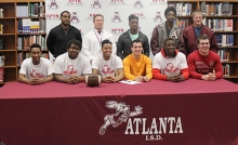 Six Atlanta High School athletes have signed letters of intent to play sports at different colleges after graduation this year. The six players seated from left: Dwayne Washington, G’Markus Garner, Dequan Allen, Chase Musgrove, Eddrick King, and Cameron Schulz. The signees are pictured here with coaches and friends. Standing from left; Coach Jarrick Farmer, Coach Matt McClure, Alvin Battle, Terrence Wilson and Garrison McCord.