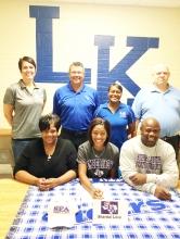 Shardai Love signed with Stephen F. Austin last week surrounded by family, friends and school officials. Seated from left, Shardai’s mother Olga Love, Shardai and father Edward Love. Standing from left, L-KHS Principal Keri Winters, L-K AD Todd Elliott, Coach Shekita Martin and Coach Daniel Kern.