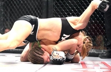 Andrea “KGB” Lee (Aaron) pounds on one of her opponents during a match inside the cage. Aaron makes her pro debut in XFC this fall after taking the amateur fighting scene by storm.