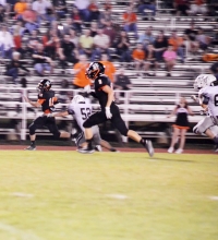 Queen City running back Cody Ball zips down the sideline and scores a touchdown in the Bulldogs’ 41-28 win over Maud.